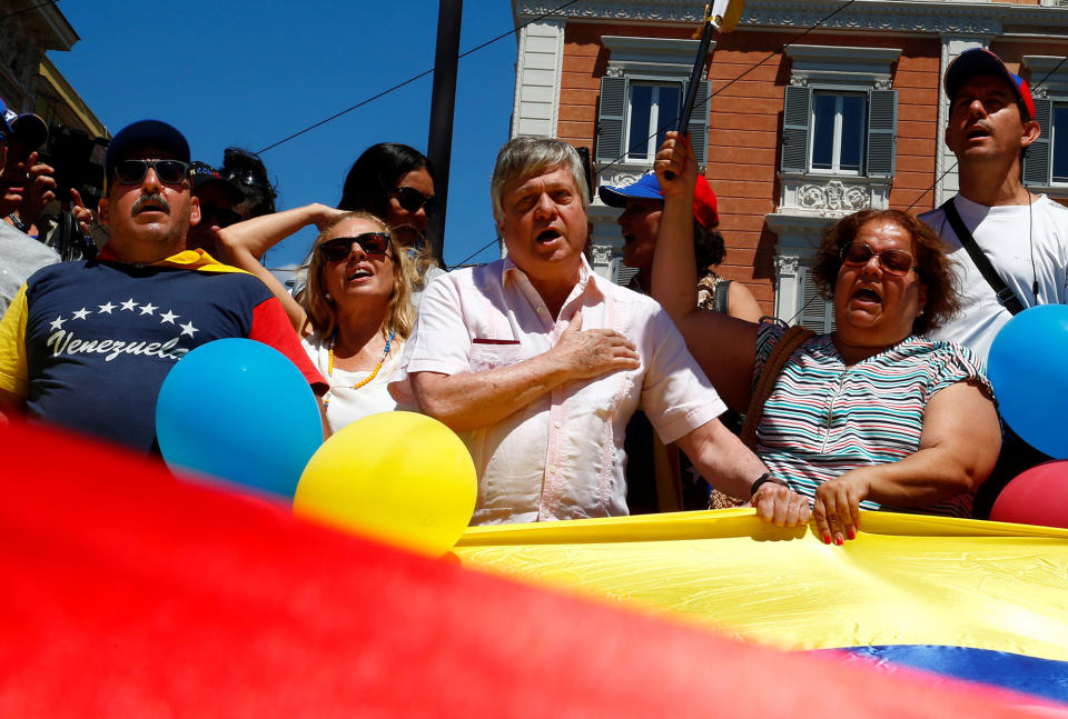 <p>Leopoldo Lopez Gil, father of Venezuelan opposition leader Leopoldo Lopez sings the national anthem as he arrives to vote during an unofficial plebiscite against Venezuela’s President Nicolas Maduro’s government in Rome, Italy July 16, 2017. (Tony Gentile/Reuters) </p>