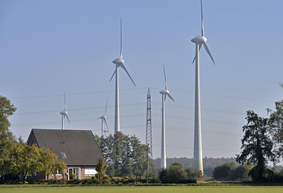 In this picture taken Oct. 12, 2012 the windmill of windfarmer Jan Marrink is pictured in Nordhorn, Germany. The crisis in Ukraine is underlining the urgency of Germany's biggest political challenge as Chancellor Angela Merkel's new government marks 100 days in office Wednesday, March 26, 2014, getting the country's mammoth transition from nuclear to renewable energy sources on track. The transition started in earnest when Merkel, after Japan's 2011 Fukushima nuclear disaster, abruptly accelerated Germany's exit from nuclear power. Since then, the "Energiewende" _ roughly, "energy turnaround" _ has created increasing headaches. (AP Photo/Martin Meissner)