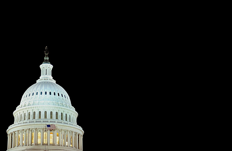 The U.S. flag flies in front of the US Capitol dome on December 24, 2008 in Washington, D.C. (KAREN BLEIER/AFP/Getty Images)