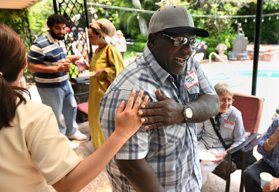 Gary Tyler chats with friends during a reunion party in Santa Monica.