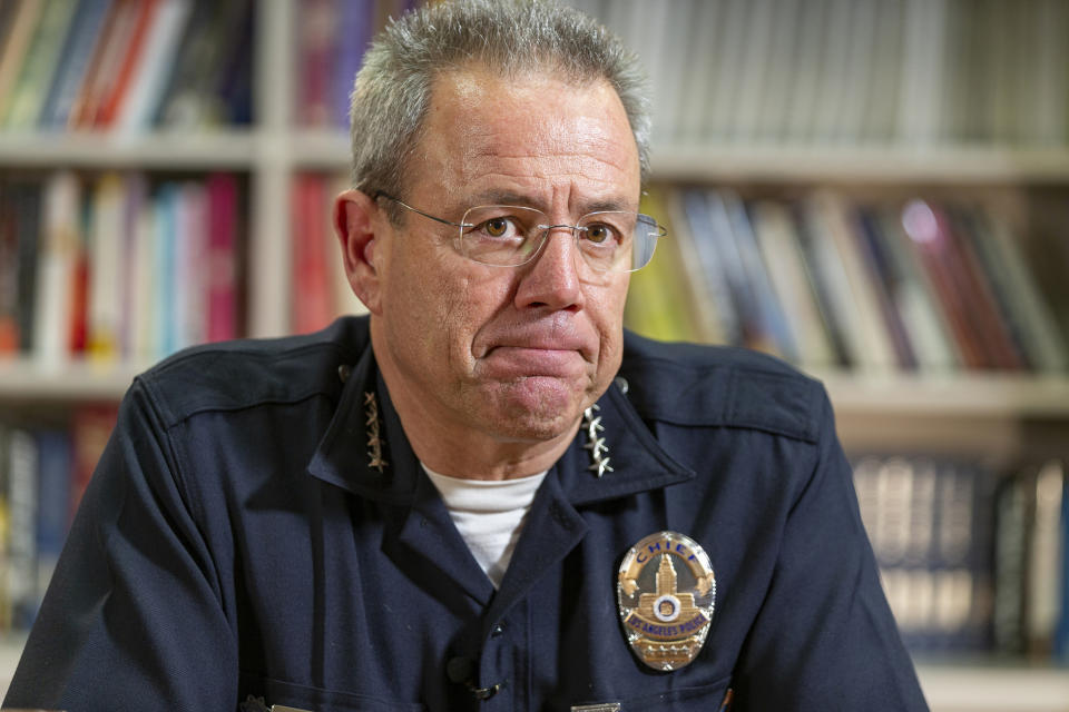 In this Wednesday, July 10, 2019 photo Los Angeles Police Department Chief Michel Moore pauses during an interview with The Associated Press in Los Angeles. Moore says homelessness is a public health and safety concern rather than a law enforcement issue that requires more mental health, sanitation and housing resources. (AP Photo/Damian Dovarganes)