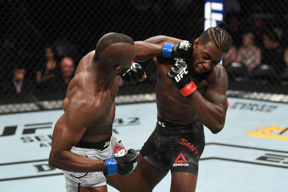 ANAHEIM, CALIFORNIA - AUGUST 17:  (L-R) Khama Worthy punches Devonte Smith in their lightweight bout during the UFC 241 event at the Honda Center on August 17, 2019 in Anaheim, California. (Photo by Josh Hedges/Zuffa LLC/Zuffa LLC via Getty Images)