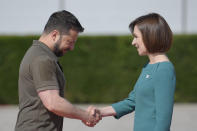 FILE - Moldova's President Maia Sandu, right, greets Ukraine's President Volodymyr Zelenskyy in Bulboaca, Moldova, June 1, 2023. She has been a frequent target of online disinformation created with artificial intelligence. (AP Photo/Vadim Ghirda, File)