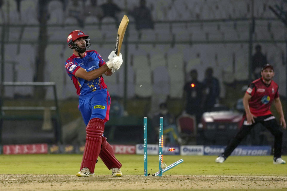 Karachi Kings' Irfan Khan is bowled out by Lahore Qalandars' Shaheen Shah Afridi during the Pakistan Super League T20 cricket match between Lahore Qalandars and Karachi Kings, in Karachi, Pakistan, Saturday, March 9, 2024. (AP Photo/Fareed Khan)