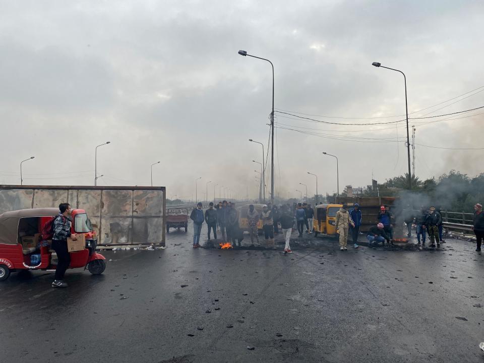 Anti-government protesters continue to shutdown a key highway in downtown Baghdad, Iraq, Thursday, Jan. 23, 2020. (AP Photo/Khalid Mohammed)
