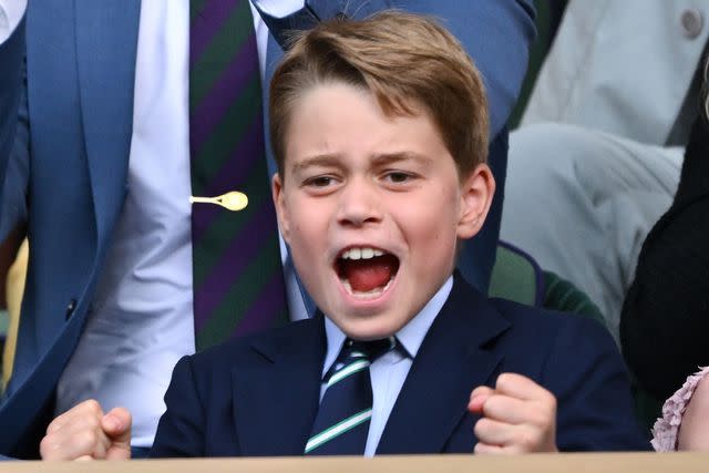 <p>Karwai Tang/WireImage</p> Prince George cheers in the Royal Box at Wimbledon on July 16.