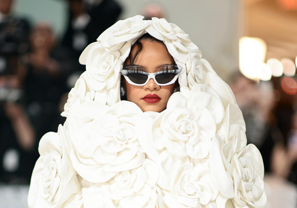 Rihanna in a flower hood on the Met Gala red carpet.