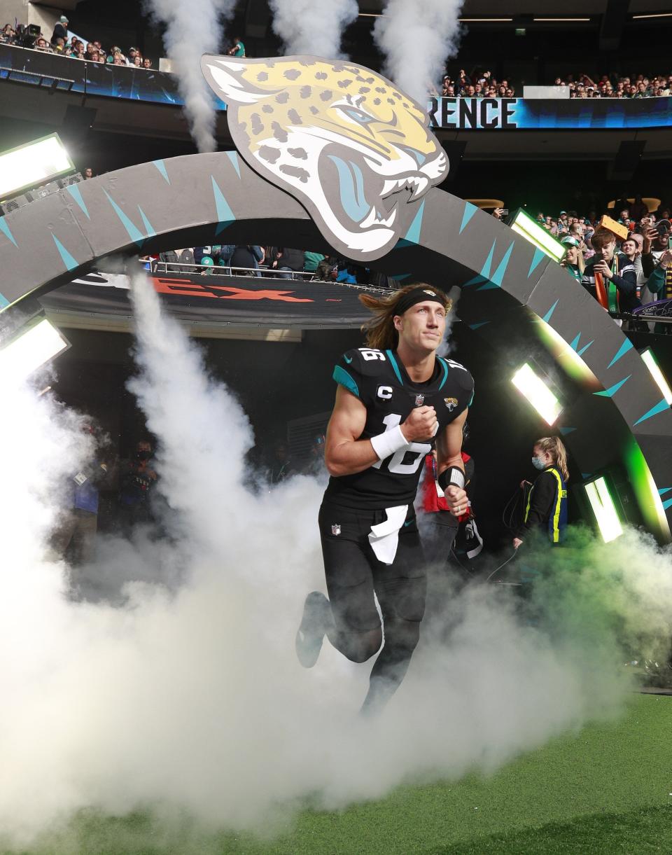 Jacksonville Jaguars quarterback Trevor Lawrence (16) runs onto the field for an NFL football game between the Miami Dolphins and the Jacksonville Jaguars at the Tottenham Hotspur stadium in London, England, Sunday, Oct. 17, 2021.