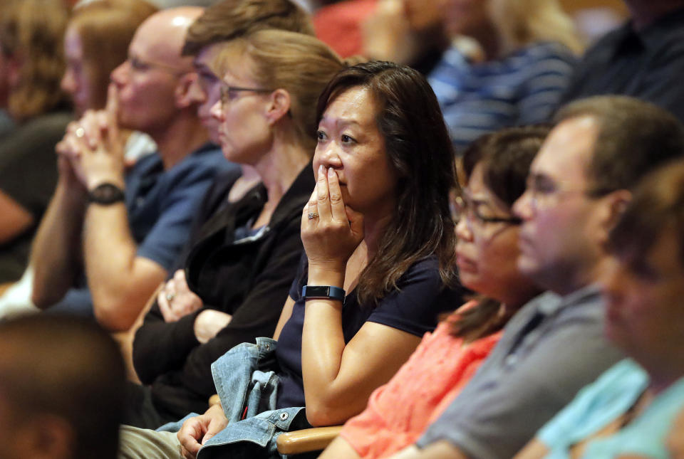 FILE - In this Wednesday, Aug. 8, 2018 file photo, audience members react as it was announced at Willow Creek Community Church in South Barrington, Ill., that lead pastor Heather Larson is stepping down, and the entire Board of Elders will do so by the end of the year. Larson said the church needed new leadership in the wake of sexual harassment allegations against church founder Bill Hybels. (Steve Lundy/Daily Herald via AP)