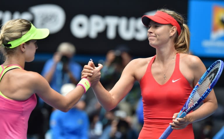 Canada's Eugenie Bouchard (L), pictured in 2015 after a match against Maria Sharapova, recently called out Sharapova as being a "cheater" and suggested the Russian should be kicked out of tennis for life