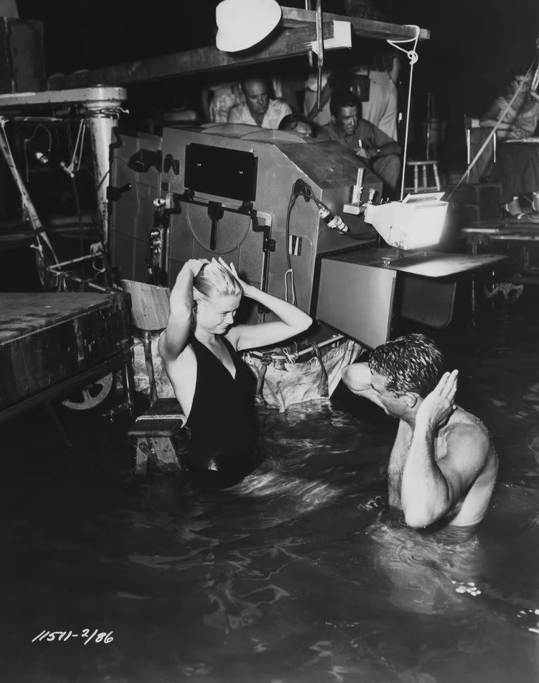 <p>Grace Kelly and Cary Grant film a scene for <em>To Catch a Thief </em>in a studio swimming pool in 1955. </p>