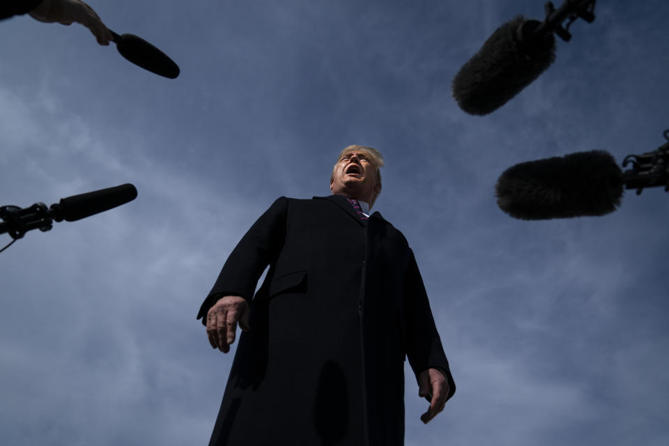 FILE - In this Feb. 18, 2020, file photo President Donald Trump talks with reporters before boarding Air Force One for a trip to Los Angeles to attend a campaign fundraiser in Andrews Air Force Base, Md. In Trump's presidency, fact checking became a cottage industry unto itself. And “alternative facts" became a buzzphrase, coined by one of his admiring aides. (AP Photo/Evan Vucci, File)