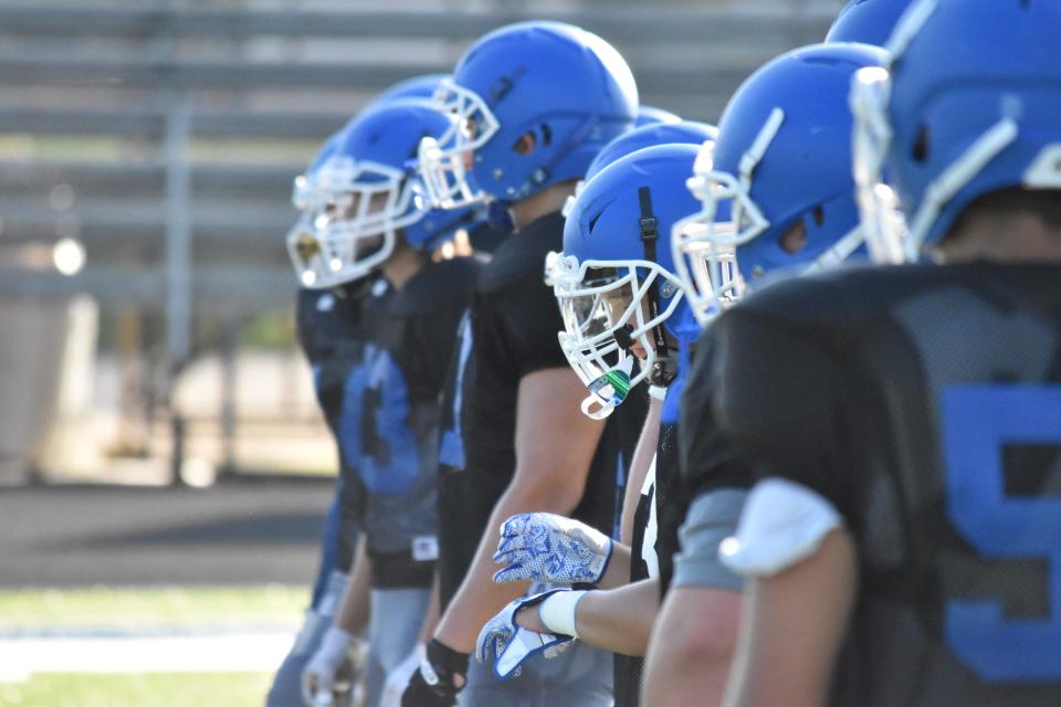 Mitchell's reserves line up during their team session in warm-ups ahead of Friday's scrimmage.