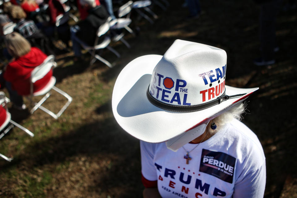 A Republican supporter wearing a Stop the Steal hat attends the Defend the Majority Rally in support of Sen. David Perdue (R-GA) and Sen. Kelly Loeffler (R-GA). (Jason Armond / Los Angeles Times via Getty Images)  