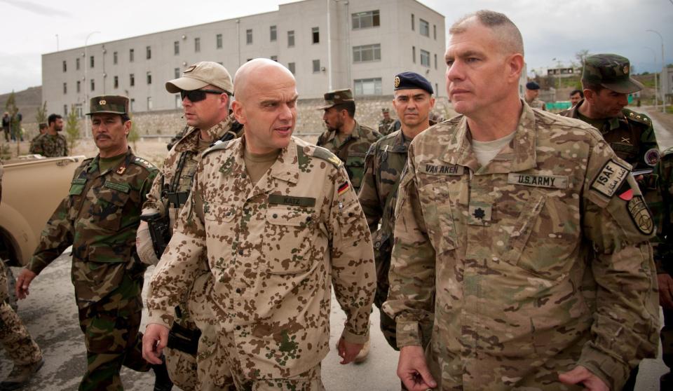 U.S. Army Lt. Col. John Van Aken, front right, accompanies German air force Brig. Gen. Gunter Katz on a walking tour around the Afghan National Defense University (ANDU) in Kabul, Afghanistan, May 7, 2013. <em>U.S. Air Force photo by Staff Sgt. Dustin Payne/Released</em>