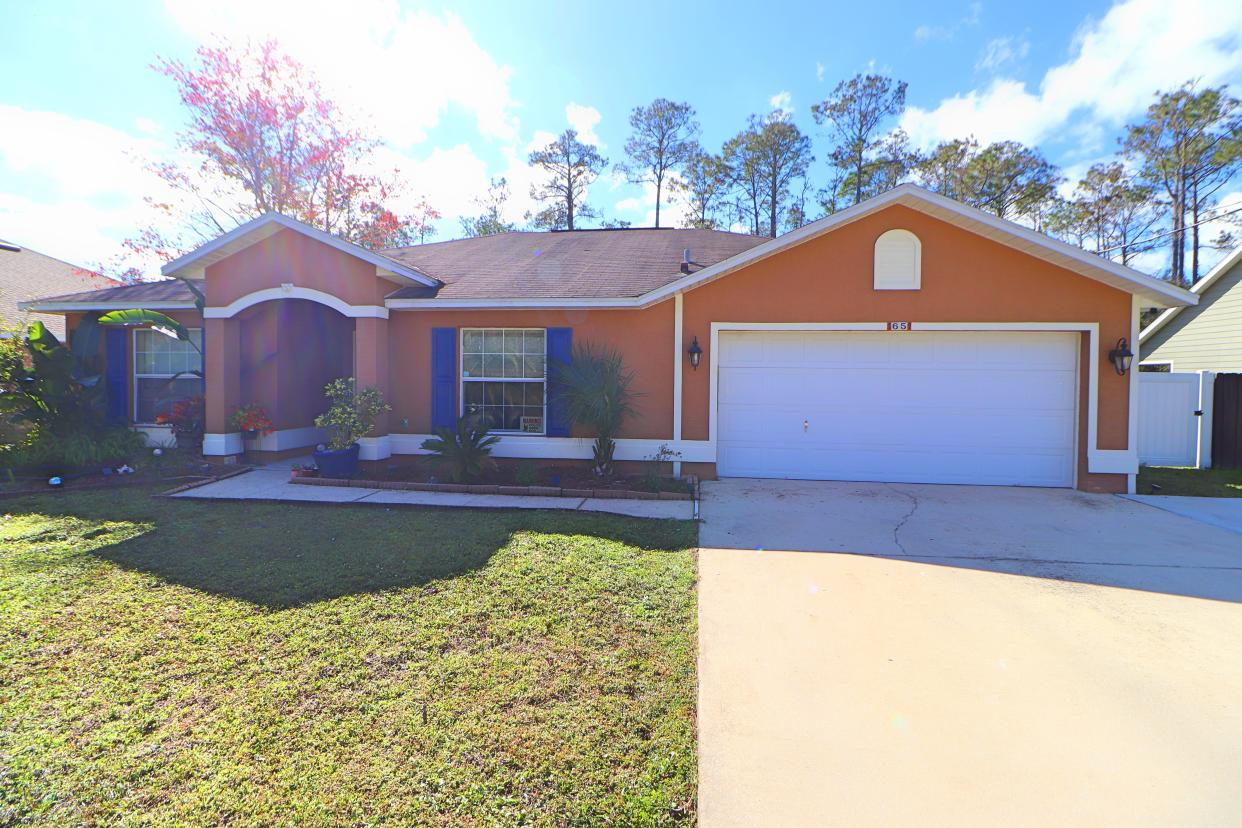 Meticulous attention to detail and design is evident in every room of this beautiful four-bedroom, two-bath split-floor-plan home in Palm Coast.