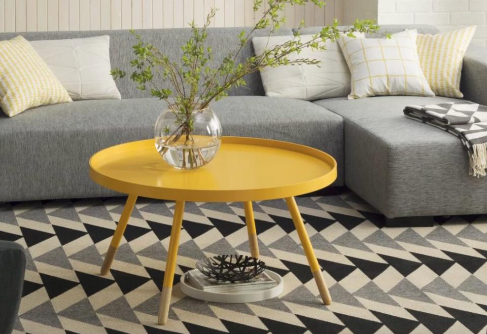 If you're not looking to spend a lot for your space, <a href="https://www.wayfair.com/furniture/pdp/mercury-row-acevedo-coffee-table-with-tray-top-mcrr7876.html?piid[0]=18102111&amp;piid=18102111#readmoremodal1" target="_blank">this coffee table is an inexpensive find</a> that comes in a multitude of colors.