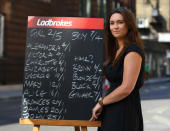 LONDON, ENGLAND - JULY 09: Public Relations Executive of Ladbrokes, Jessica Bridge, poses for a picture with today's odds for the royal baby on a chalk board in front of the Lindo Wing as the UK prepares for the birth of the first child of The Duke and Duchess of Cambridge at St Mary's Hospital on July 9, 2013 in London, England. (Photo by Jordan Mansfield/Getty Images) <br>