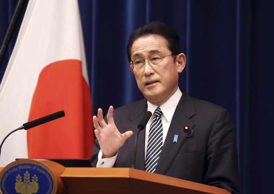 Japanese Prime Minister Fumio Kishida speaks during a press conference at the prime minister's official residence in Tokyo Tuesday, Dec. 21, 2021, as an extraordinary Diet session was closed on Tuesday. Japan’s parliament on Monday approved a record extra budget of nearly 36 trillion yen ($317 billion) for the fiscal year through March to help out pandemic-hit households and businesses.(Yoshikazu Tsuno/Pool Photo via AP)