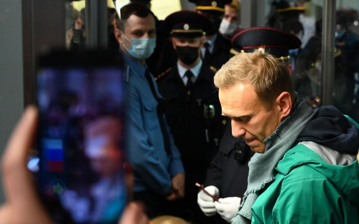 Alexei Navalny was detained at passport control at Moscow's Sheremetyevo airport on Sunday evening - Kirill Kudryavtsev/AFP