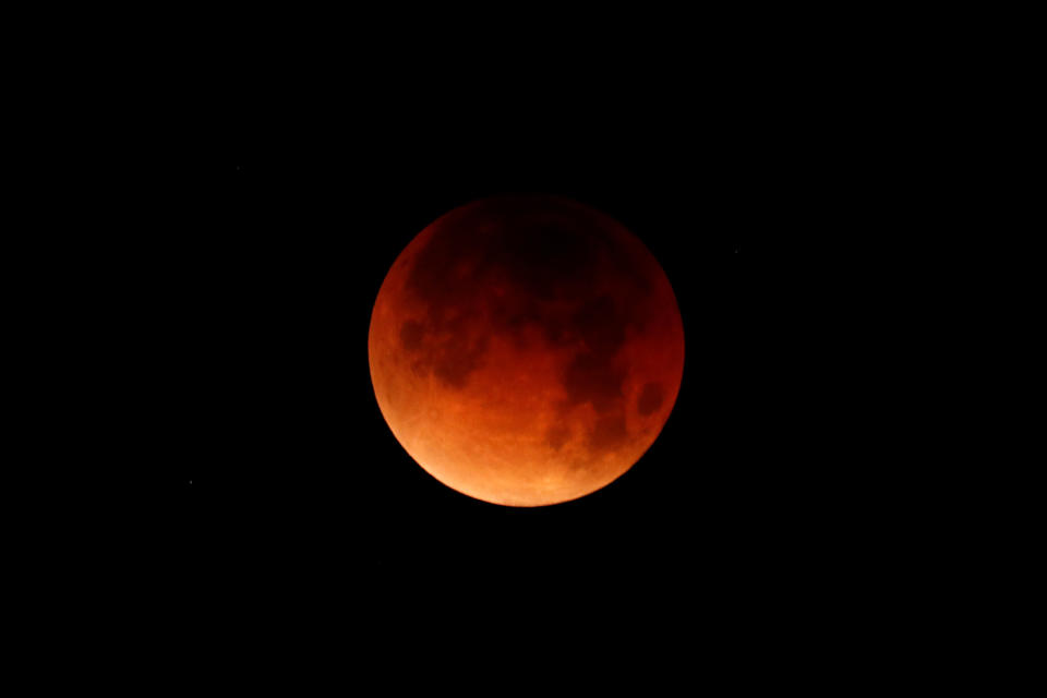 The moon is shown&nbsp;over the ocean in Oceanside, California.