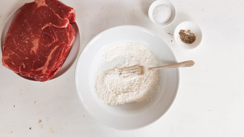 flour with salt and pepper in a bowl