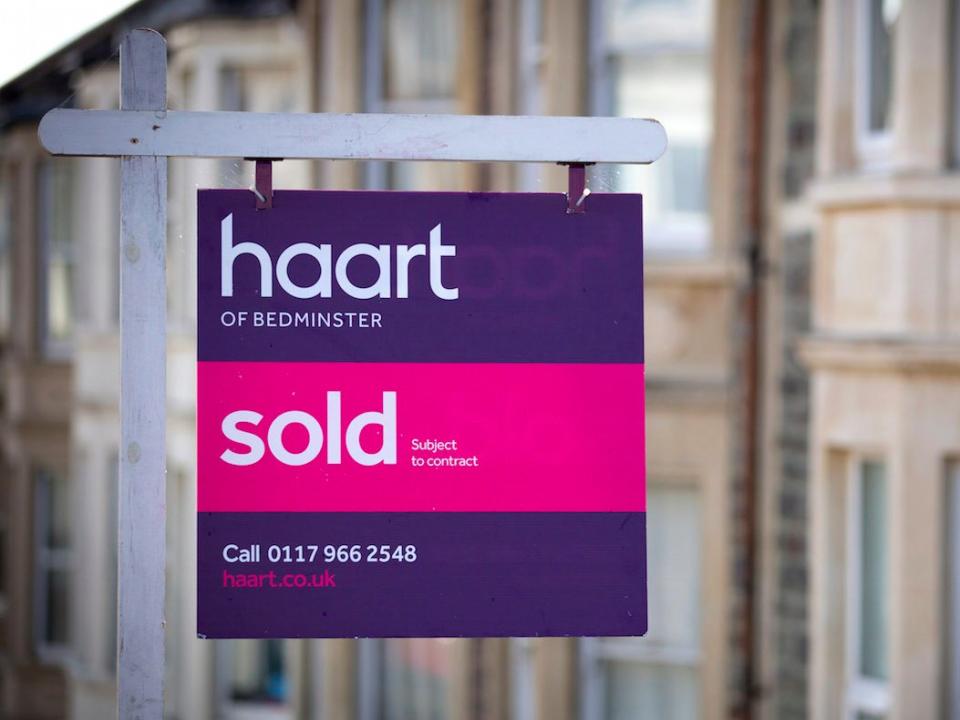 A estate agent's board is seen outside a property on October 8, 2014 in Bristol, England. On the first anniversary of the introduction of second phase of the Help to Buy scheme, which provides a government partial guarantee on high loan-to-value mortgages, a new survey from the The Centre for Economics and Business Research (CEBR) claims that house prices in 2015 are set for their first decline since 2011. (Photo by Matt Cardy/Getty Images)