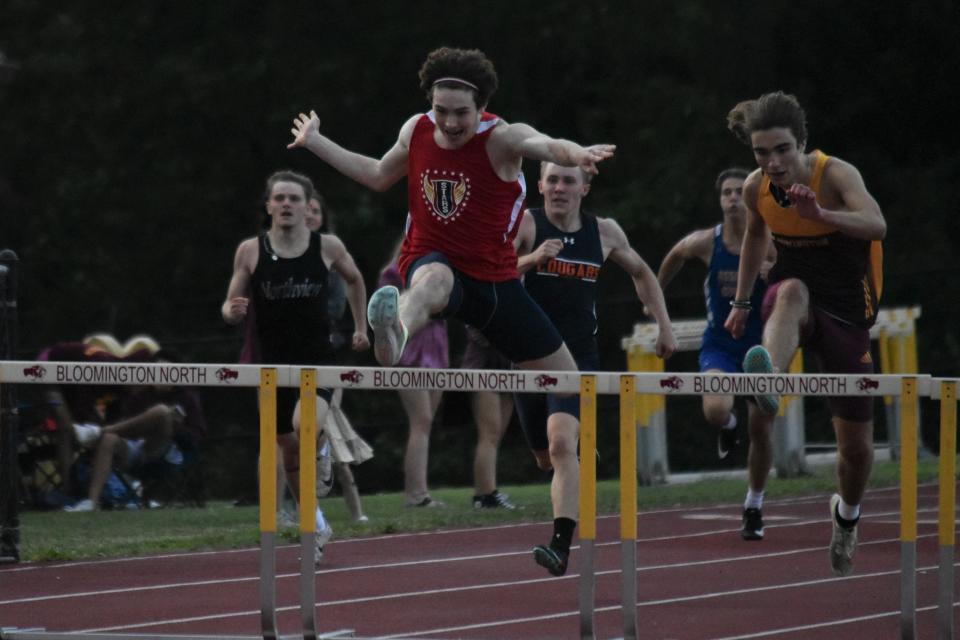 Bedford North Lawrence's Zane Thompson paces the field during the 300-meter hurdles at the 2022 Bloomington North Boys' Track and Field Regional.