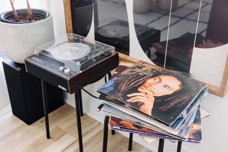 Record player and stack of vinyl records