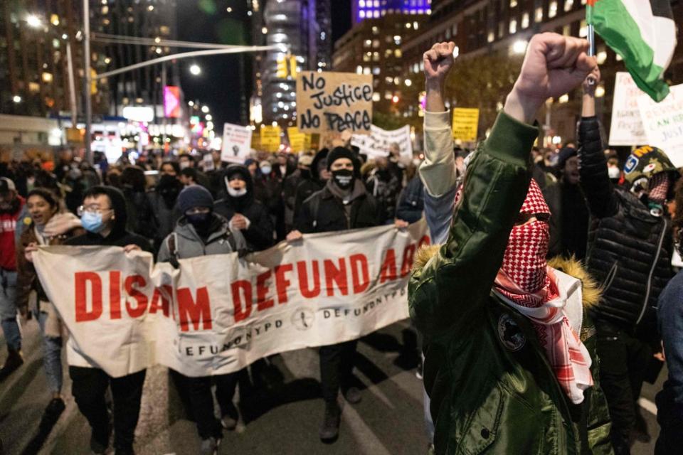 Demonstrators march in Brooklyn, New York following the verdict in the Kyle Rittenhouse trial (AFP via Getty Images)