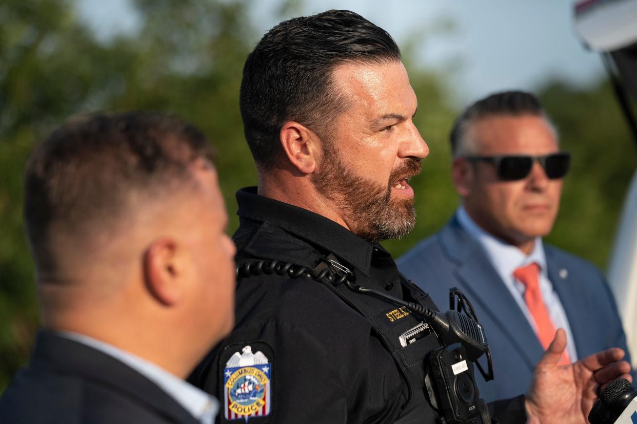 Brian Steel, a Columbus police officer and executive vice president of the Fraternal Order of Police Capital City Lodge No. 9, speaks at a Thursday evening press conference to the events Thursday when three individuals allegedly stole a Porsche SUV in Whitehall and robbed a bank on Columbus' West Side before engaging law enforcement in a shootout on Interstate 70 east in Columbus. A Columbus police officer was critically wounded and one suspect was killed. Two suspects remained at-large late Thursday.