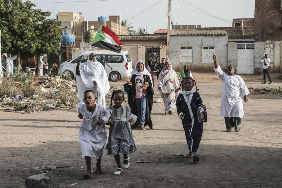 Sudanese children along with adults celebrate in the streets of Khartoum after ruling generals and protest leaders announced they have reached an agreement on the disputed issue of a new governing body on Friday, July 5, 2019. The deal raised hopes it will end a three-month political crisis that paralyzed the country and led to a violent crackdown that killed scores of protesters. (AP Photo)