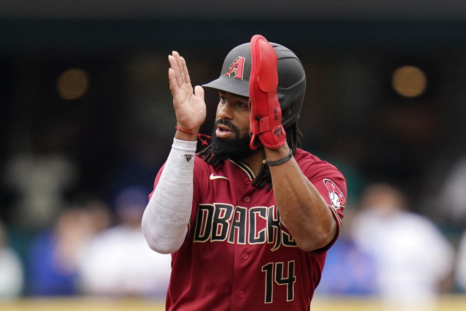 Arizona Diamondbacks' Henry Ramos applauds play as he leads off second base after his two-run double against the Seattle Mariners in the sixth inning of a baseball game Sunday, Sept. 12, 2021, in Seattle. (AP Photo/Elaine Thompson)