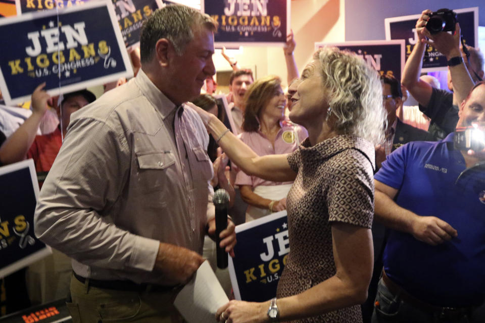 Virginia state Sen. Jen Kiggans, R-Virginia Beach, talks to former Gov. George Allen as she prepares to speak to supporters during an election party, Tuesday, June 21, 2022, in Virginia Beach, Va. Kiggans won a primary to face Democrat Elaine Luria in November's election. (AP Photo/Steve Helber)