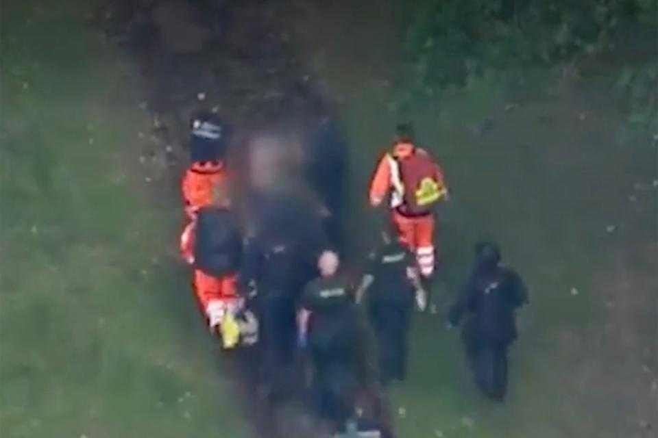 Aerial footage appeared to show Kyle Clifford being stretchered from a cemetery in Enfield (Sky News)