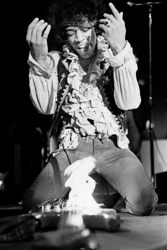 Jimi Hendrix sets fire to his Fender Stratocaster guitar while performing at the Monterey International Pop music festival, June 1967.