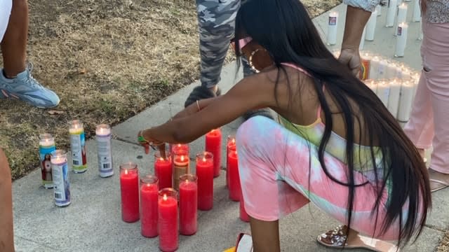 Family and friends pay light candles for Mikeona Johnson following the news of her passing in Los Angeles in September 2020.