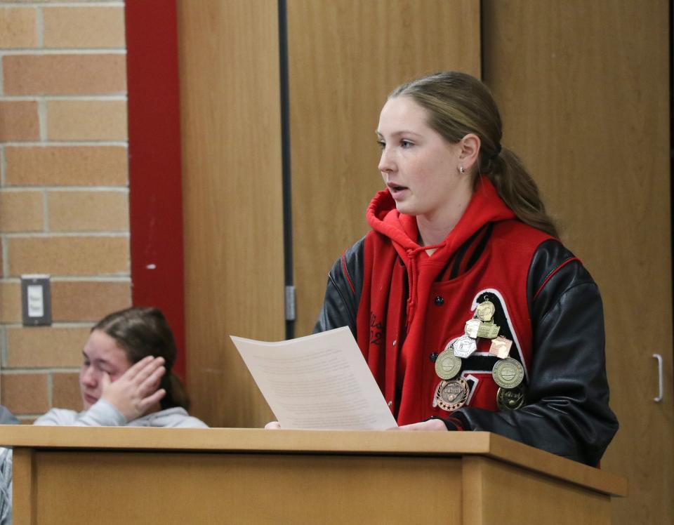Alisha Gahn, a senior at Addison Community Schools, raises concerns about the Addison varsity softball program Monday, Dec. 18, 2023, at the district's Board of Education meeting.