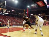 May 16, 2018; Houston, TX, USA; Houston Rockets guard James Harden (13) loses the ball against Golden State Warriors forward Andre Iguodala (9) and forward Draymond Green (23) during the first half in game two of the Western conference finals of the 2018 NBA Playoffs at Toyota Center. Mandatory Credit: Thomas B. Shea-USA TODAY Sports