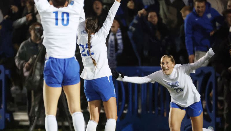 BYU midfielder Bella Folino (22) celebrates her goal against USC with BYU midfielder Olivia Katoa (10) and BYU forward Allie Fryer (23) during the second round of the NCAA championship in Provo on Thursday, Nov. 16, 2023. BYU won 1-0.