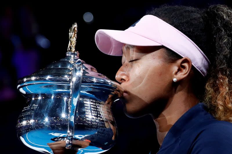 FILE PHOTO: Japan's Naomi Osaka kisses the Australian Open trophy