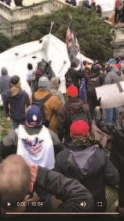 A screenshot from a video that prosecutors say Jesus Rivera uploaded Jan. 6, 2021, shows a large and loud protest on the U.S. Capitol grounds.