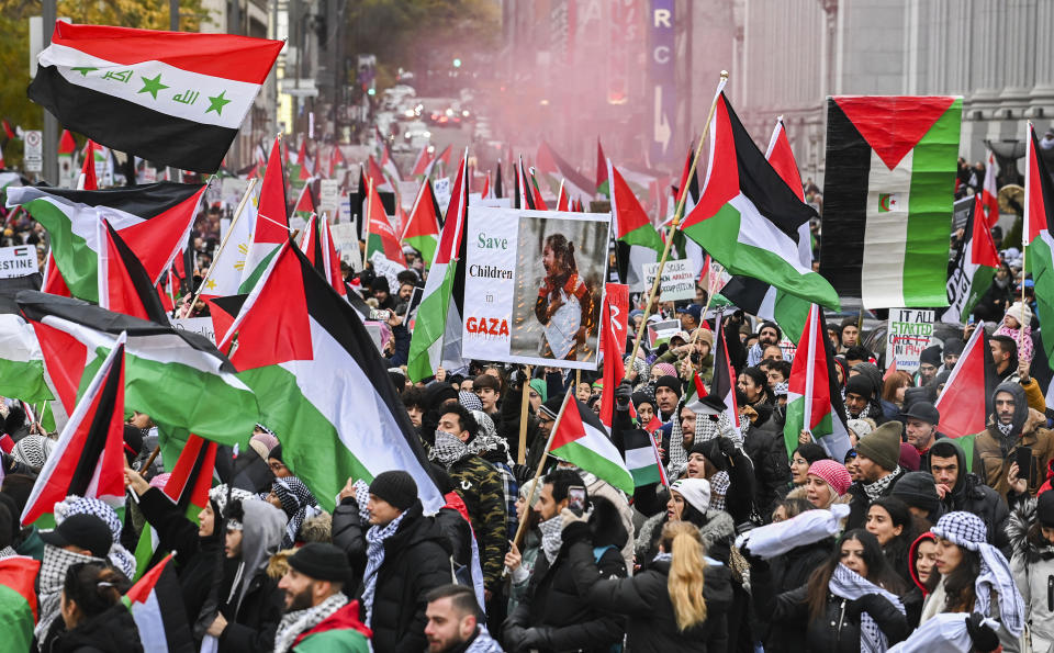 People demonstrate in a pro-Palestinian rally in Montreal, Sunday, Nov. 12, 2023. (Graham Hughes/The Canadian Press via AP)