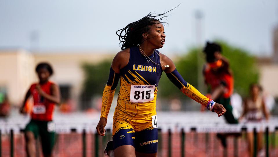 LehighÕs Sanaa Geter wins the 100 meter hurdles at Lee County Athletic Conference Championships at Dunbar High School on Saturday, April 9, 2022. Morrison won and Young was second.  