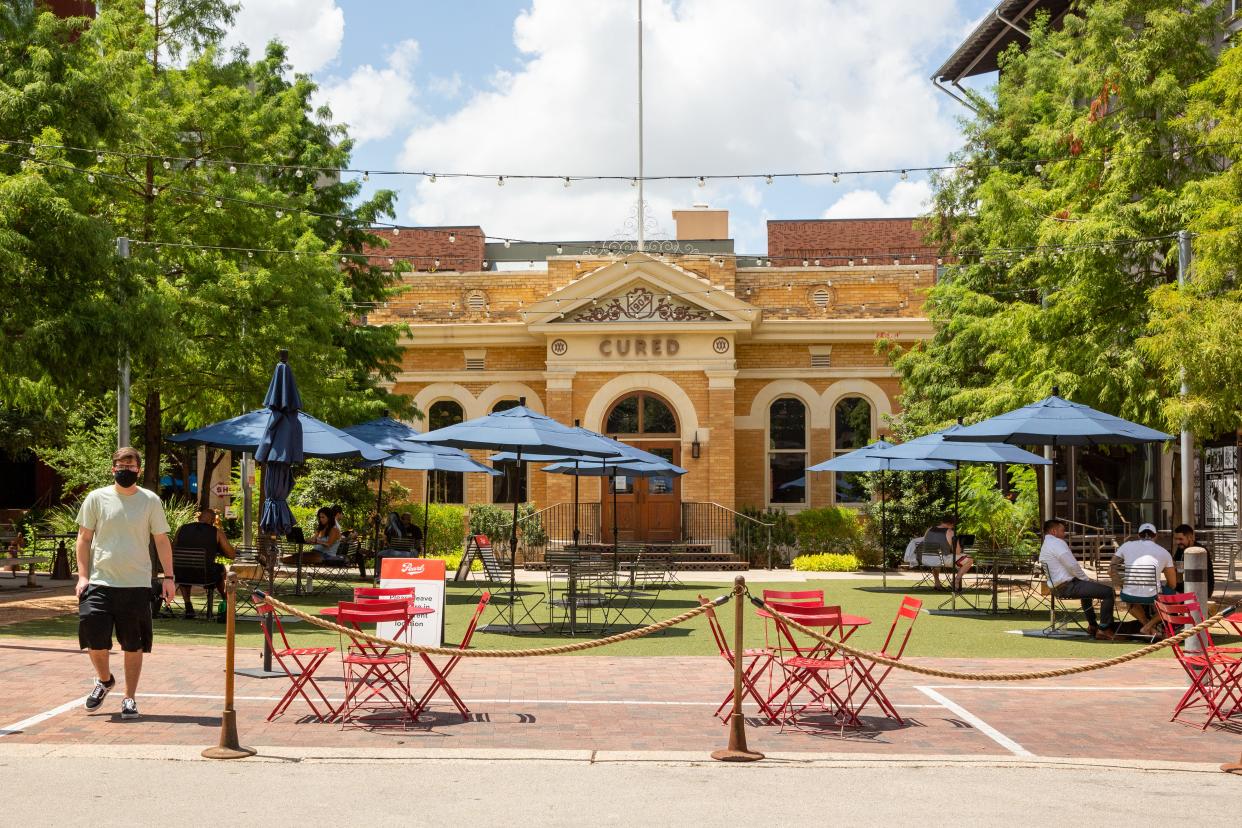New technology at San Antonio’s wildly popular Pearl Brewery allows diners at outside tables to combine choices from multiple food hall vendors into a single order delivered tableside.
