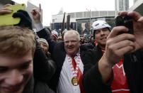 Toronto Mayor Rob Ford (C) celebrates Team Canada's gold medal win over Sweden in the men's ice hockey gold medal game at the Sochi 2014 Winter Olympic Games, in Toronto, February 23, 2014. REUTERS/Aaron Harris (CANADA - Tags: POLITICS)