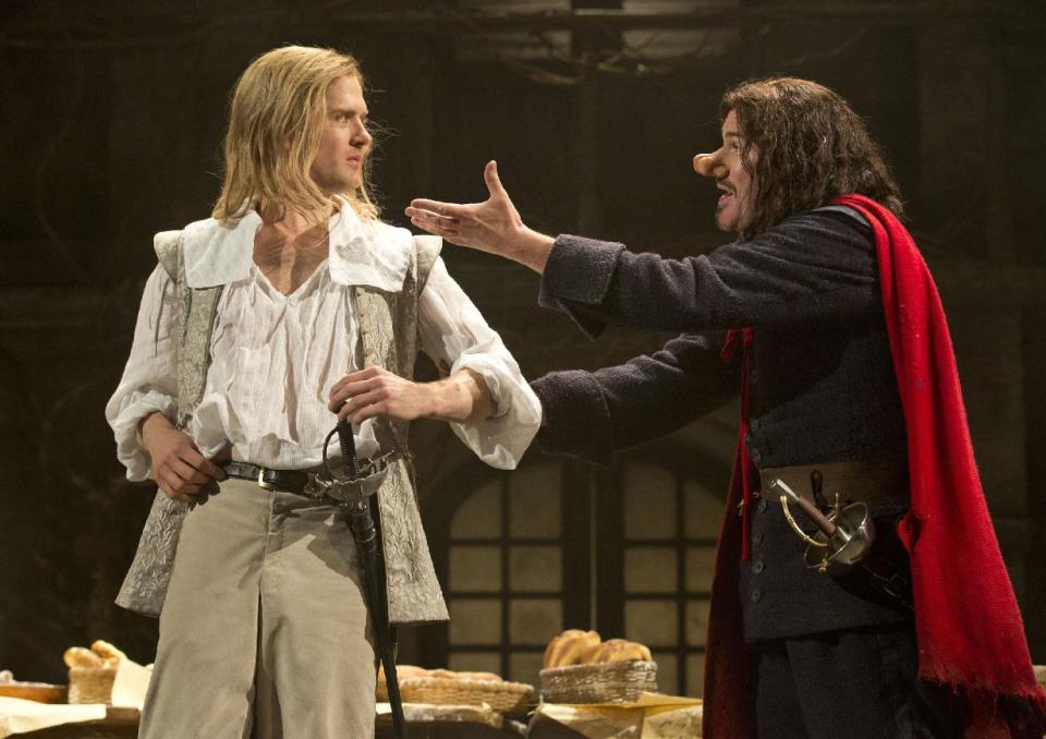 This theater image released by Boneau-Bryan/Brown shows Kyle Soller, left, and Douglas Hodge portraying the title role in "Cyrano de Bergerac," playing at the American Airlines Theatre in New York. (AP Photo/Boneau-Bryan/Brown, Joan Marcus)