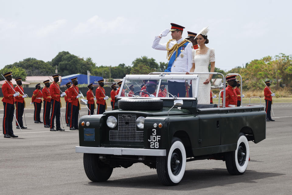 KINGSTON, JAMAICA – MARCH 24: (UK OUT FOR 28 DAYS) Catherine, Duchess of Cambridge and Prince William, Duke of Cambridge ride in a Land Rover as they attend the inaugural Commissioning Parade for service personnel from across the Caribbean with Prince William, Duke of Cambridge, at the Jamaica Defence Force on day six of the Platinum Jubilee Royal Tour of the Caribbean on March 24, 2022 in Kingston, Jamaica. The Duke and Duchess of Cambridge are visiting Belize, Jamaica, and The Bahamas on their week-long tour. (Photo by Pool/Samir Hussein/WireImage)