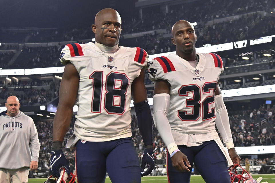 New England Patriots wide receiver Matthew Slater (18) and safety Devin McCourty walk off the field after their 30-24 loss to the Las Vegas Raiders during an NFL football game, Sunday, Dec. 18, 2022, in Las Vegas. (AP Photo/David Becker)