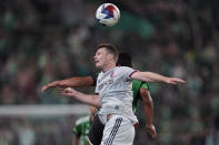 St Louis City SC Joakim Nilsson (4) heads the ball past Austin FC defender Nick Lima (24) during the second half of an MLS soccer match in Austin, Texas, Saturday, Feb. 25, 2023. (AP Photo/Eric Gay)